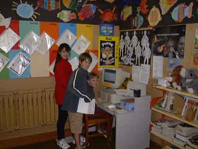 children working on computer.